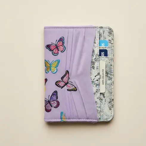  A lavender chiffon-over-cotton passport cover with multicolored butterfly embroidery.