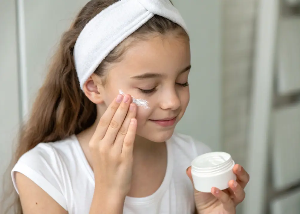 skincare aesthetic rituals girl applying moisturizer on face