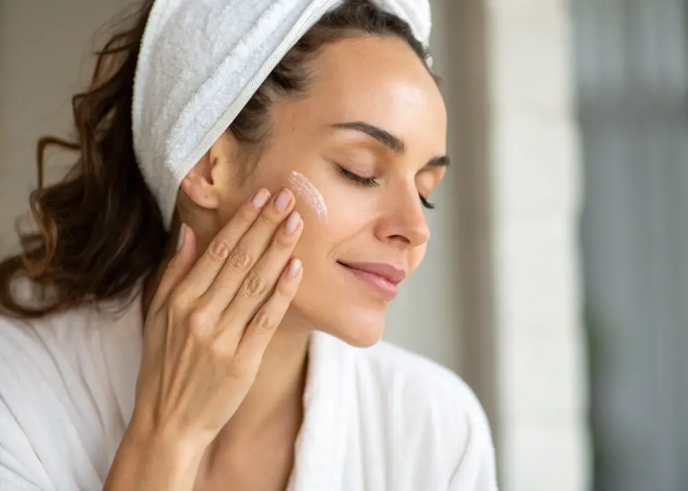  Applying oil cleanser as the first step of a glass skin routine.
